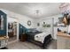 A brightly lit bedroom with a walk-in closet and neutral colors and modern furnishings at 820 Hickory Ln, Palm Harbor, FL 34683