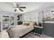 Inviting bedroom offers a peaceful retreat with a view of the pool, ample light, and stylish decor at 820 Hickory Ln, Palm Harbor, FL 34683
