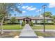 Charming clubhouse with manicured landscaping and inviting entrance, perfect for community gatherings at 820 Hickory Ln, Palm Harbor, FL 34683