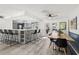 Bright dining area with a bar, a unique wood table, and easy access to the patio at 820 Hickory Ln, Palm Harbor, FL 34683