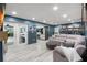 Open-concept living area with access to the patio, and includes a view of the kitchen and dining areas at 820 Hickory Ln, Palm Harbor, FL 34683