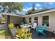 Relaxing outdoor patio with a fire table and seating area, perfect for enjoying warm evenings at 820 Hickory Ln, Palm Harbor, FL 34683