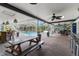 Entertain in this lanai featuring a pool and outdoor dining area with bar seating at 820 Hickory Ln, Palm Harbor, FL 34683