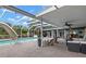 Inviting, screened-in pool with spacious patio and comfortable seating, ideal for outdoor relaxation at 820 Hickory Ln, Palm Harbor, FL 34683
