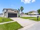 Classic two-story home featuring a well-maintained lawn and an attached garage at 908 Stallion Way, Valrico, FL 33594