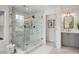 This bathroom features a luxe shower, gray vanity, and stylish fixtures that provide a spa-like retreat at 101 Ponce De Leon Blvd, Belleair, FL 33756