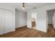 Bedroom featuring hardwood floors, closet, and an en suite bathroom at 101 Ponce De Leon Blvd, Belleair, FL 33756