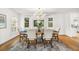 Bright dining room with views and a stylish chandelier at 101 Ponce De Leon Blvd, Belleair, FL 33756