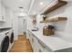 Bright laundry room with ample counter space, built-in cabinets, and modern washer/dryer at 101 Ponce De Leon Blvd, Belleair, FL 33756