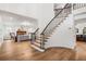 Bright living room with a fireplace and hardwood floors at 101 Ponce De Leon Blvd, Belleair, FL 33756