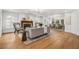 Cozy living room with fireplace and open floor plan to dining room at 101 Ponce De Leon Blvd, Belleair, FL 33756
