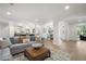 Open concept living area that flows into the kitchen and dining area with hardwood floors at 101 Ponce De Leon Blvd, Belleair, FL 33756