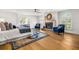 Bright main bedroom boasts hardwood floors, a fireplace, and cozy seating for a relaxing retreat at 101 Ponce De Leon Blvd, Belleair, FL 33756