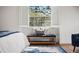 Relax in this bedroom nook with bench seating, sunlight, and beautiful views from the window at 101 Ponce De Leon Blvd, Belleair, FL 33756