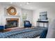 Inviting main bedroom features a brick fireplace, hardwood floors, and bright, airy windows at 101 Ponce De Leon Blvd, Belleair, FL 33756