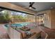 A spacious screened-in patio with comfortable seating that overlooks a beautiful swimming pool at 101 Ponce De Leon Blvd, Belleair, FL 33756