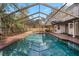 A gorgeous screened-in pool, creating a relaxing outdoor oasis for enjoyment and recreation at 101 Ponce De Leon Blvd, Belleair, FL 33756