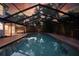 Enjoy evening relaxation in your screened pool and outdoor entertainment area at 101 Ponce De Leon Blvd, Belleair, FL 33756
