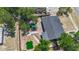 An aerial view of a cozy home with a well-maintained yard featuring lush greenery and outdoor entertaining spaces at 10931 110Th Ave, Seminole, FL 33778