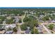 An elevated view displays a neighborhood street lined with mature trees and tidy homes in a suburban community at 10931 110Th Ave, Seminole, FL 33778