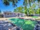 Charming home with a lovely backyard, featuring a patio and lush greenery for relaxation at 10931 110Th Ave, Seminole, FL 33778