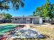 Spacious backyard featuring a patio and lush landscaping, perfect for outdoor activities and gatherings at 10931 110Th Ave, Seminole, FL 33778
