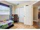 Cozy bedroom with hardwood floors, natural light from the window, and study area at 10931 110Th Ave, Seminole, FL 33778