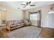Bright and airy living room showcasing tile floors, large window, and cozy seating arrangement at 10931 110Th Ave, Seminole, FL 33778