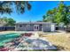Spacious backyard featuring a patio, white rock garden, and privacy fence at 10931 110Th Ave, Seminole, FL 33778