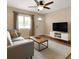 Cozy living room with modern furnishings, neutral tones, and bright natural lighting at 10931 110Th Ave, Seminole, FL 33778