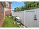 Backyard has artificial turf and white fencing, creating a private and low-maintenance outdoor space at 1116 Martin Luther King Jr Ave, Dunedin, FL 34698