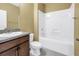 Clean bathroom features a tub and dark wood vanity at 1116 Martin Luther King Jr Ave, Dunedin, FL 34698