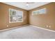 Bright bedroom featuring two windows offering natural light and a ceiling fan for added comfort at 1116 Martin Luther King Jr Ave, Dunedin, FL 34698