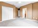 Bedroom with carpeting, large closet with sliding doors and doorway to the en suite bath at 1116 Martin Luther King Jr Ave, Dunedin, FL 34698
