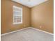 Neutral bedroom with ample light and carpet at 1116 Martin Luther King Jr Ave, Dunedin, FL 34698