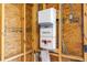 Close-up of a SolarCity electrical panel with warning labels mounted on an unfinished wall at 1116 Martin Luther King Jr Ave, Dunedin, FL 34698