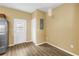 Convenient entryway features outside access door, closet, and modern luxury vinyl plank flooring at 1116 Martin Luther King Jr Ave, Dunedin, FL 34698