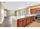 Open concept: kitchen boasts stainless appliances, quartz countertops and island seating at 1116 Martin Luther King Jr Ave, Dunedin, FL 34698