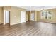 Spacious living room with contemporary lighting, neutral paint, and modern flooring at 1116 Martin Luther King Jr Ave, Dunedin, FL 34698