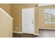 Comfortable living area with vinyl floors and access to the main entrance at 1116 Martin Luther King Jr Ave, Dunedin, FL 34698