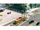 Aerial view showcasing the city, train, trolley, cars, and businesses at 1227 E Madison St # 902, Tampa, FL 33602