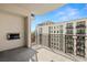 Large balcony featuring dark metal railings, concrete floors, and a view of a nearby building at 1227 E Madison St # 902, Tampa, FL 33602