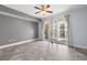 Bedroom with fan, sliding glass doors and access to private balcony at 1227 E Madison St # 902, Tampa, FL 33602