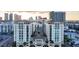 Wide shot of the building complex showcasing its architecture and surrounding cityscape at sunset at 1227 E Madison St # 902, Tampa, FL 33602