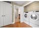 Convenient laundry area with a washer and dryer and storage shelving at 1227 E Madison St # 902, Tampa, FL 33602