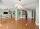 Spacious open-concept living area with hardwood floors, kitchen and modern fixtures at 1227 E Madison St # 902, Tampa, FL 33602