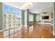 Bright living room with hardwood floors, modern lighting, and large windows showcasing city views at 1227 E Madison St # 902, Tampa, FL 33602