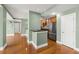 View of the open floorplan with a kitchen bar and stainless steel refrigerator at 1227 E Madison St # 902, Tampa, FL 33602