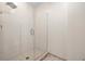 Modern shower with white tile surround, glass doors, and a rainfall showerhead at 1227 E Madison St # 902, Tampa, FL 33602
