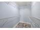 Walk-in closet with wooden-look floors and wire rack shelving for ample storage at 1227 E Madison St # 902, Tampa, FL 33602